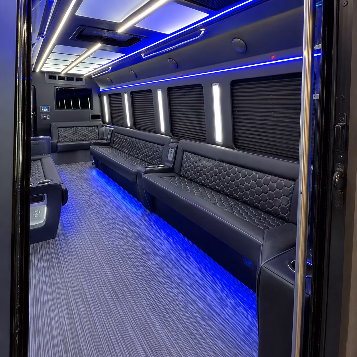 Wedding guests seated inside a party bus serving Tulsa